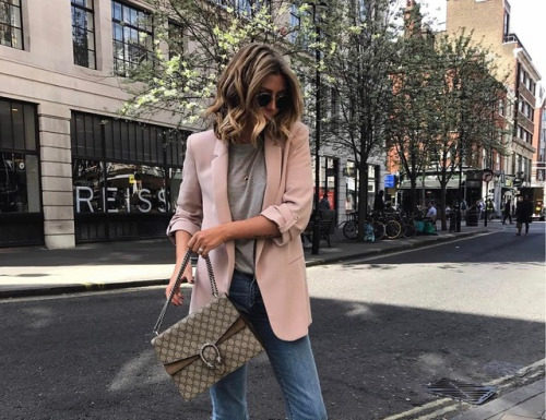 Street Style : Emma Hill is wearing a blazer in a playful shade of pale pink,…