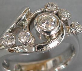 Diamond Rings : right hand ring….three small with the kids birth stones…the other two hubby …