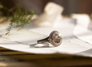 Engagement Rings & Wedding Rings : 18k white gold featuring a large brown Oregon sunstone and surrounded by 30 diam…