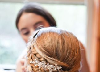 Wedding Hair With Flowers & jewels : Elegant low updo wedding hairstyle with glam diamond hairpiece; Featured Photogr…