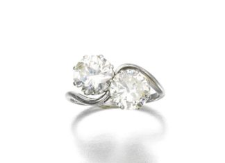 Diamond Rings : DIAMOND RING of cross-over design set with two circular-cut diamonds weighing 1….
