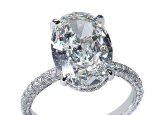 Diamond Rings : #Platinum and diamond ring by Rahaminov—with a center oval #diamond weighing 4…