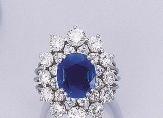 Loose Diamond : A SAPPHIRE AND DIAMOND CLUSTER RING Set with a cushion-shaped sapphire weighin…