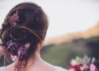 Wedding Hair With Flowers & jewels : Stunning bridal updo with purple flowers…