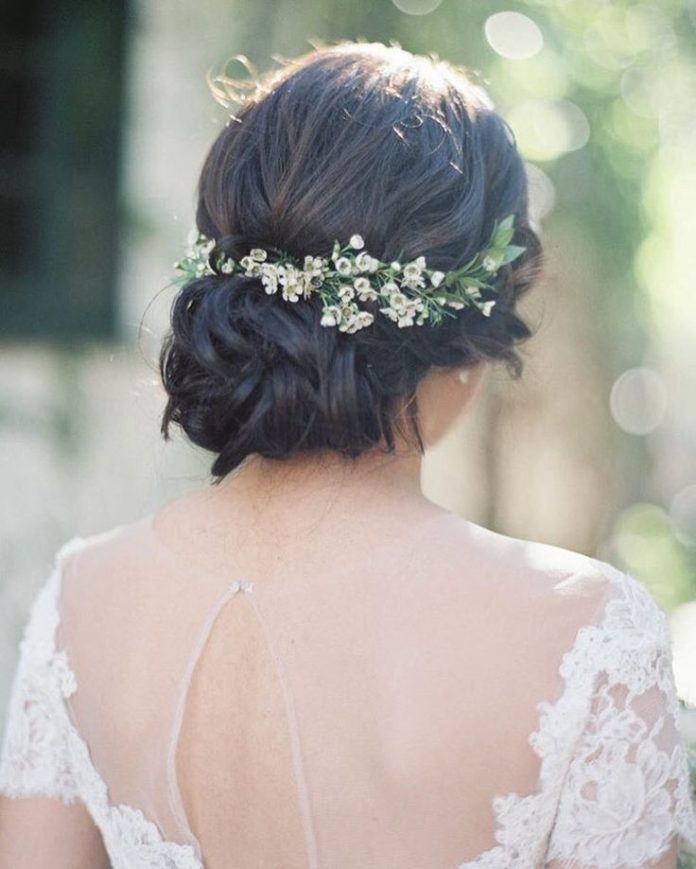 Style Me Pretty on Instagram: “Loving this messy bun detailed with tiny wax fl...