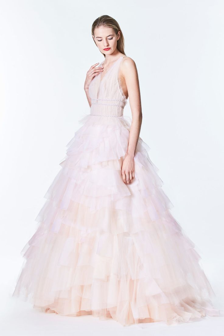 Blush ruffled Monique Lhuillier wedding dress: Photography: Courtesy Carolina He...