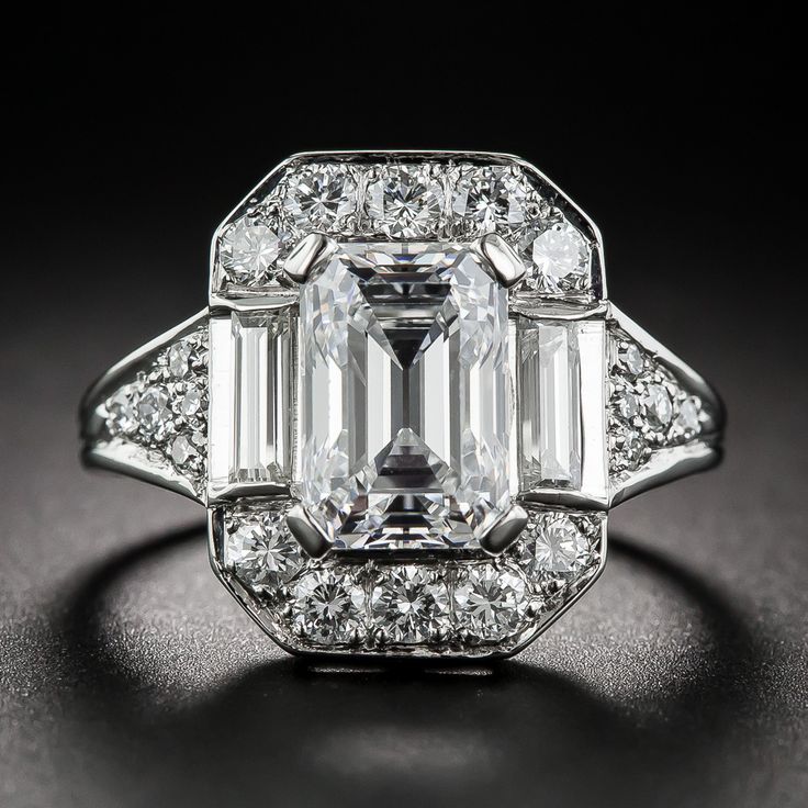 A classically modeled, vintage emerald-cut diamond, weighing just shy of two-and...