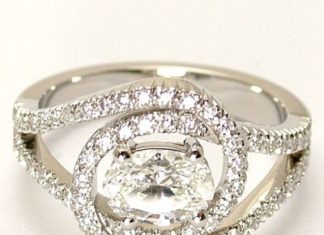 Diamond Rings : Unique Engagement Ring, Handmade in platinum with an oval diamond centre and cut…