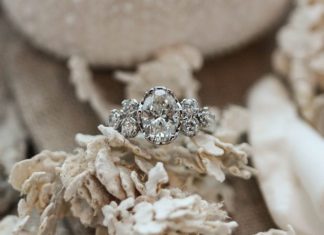 Engagement Rings & Wedding Rings : Platinum crown setting with oval center stone and round brilliant diamond cluste…