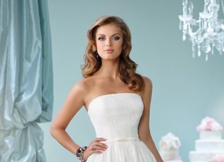 Short Wedding Dresses : Brides.com: . Style 116122, strapless knee-length lace A-line dress with a scall…