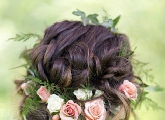 Wedding Hair With Flowers & jewels : This low updo gives off the appearance that the flowers are beautifully woven in…