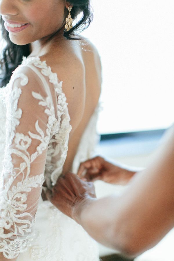 Sheer lace long sleeve wedding dress: www.stylemepretty... | Photography: Jacqui...