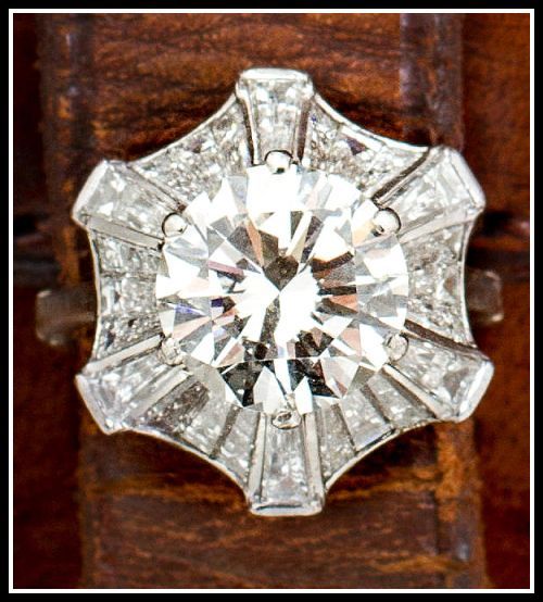 Diamond engagement ring with a 5 carat round brilliant-cut diamond in a 2.5 cara...