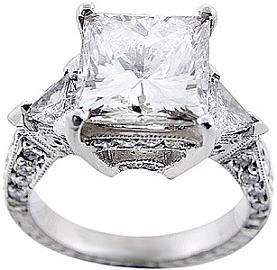 Splendid 4.00 carat triangle diamond ring: Princess cut diamond in the center se...