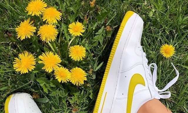 nike air force 1 shoes : Yellow and white Nike Air Force 1 sneakers.